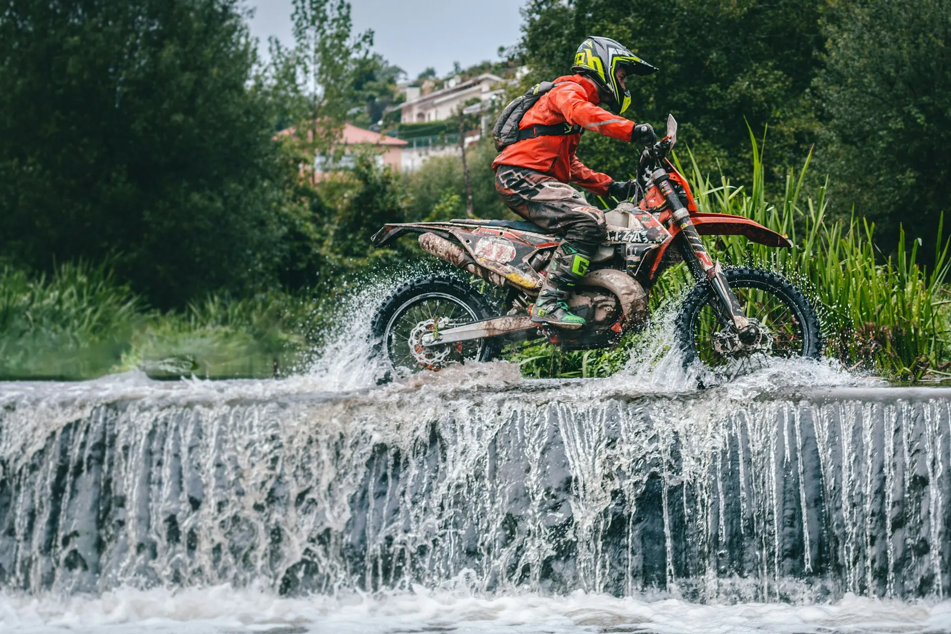 Enduro rider crossing a river